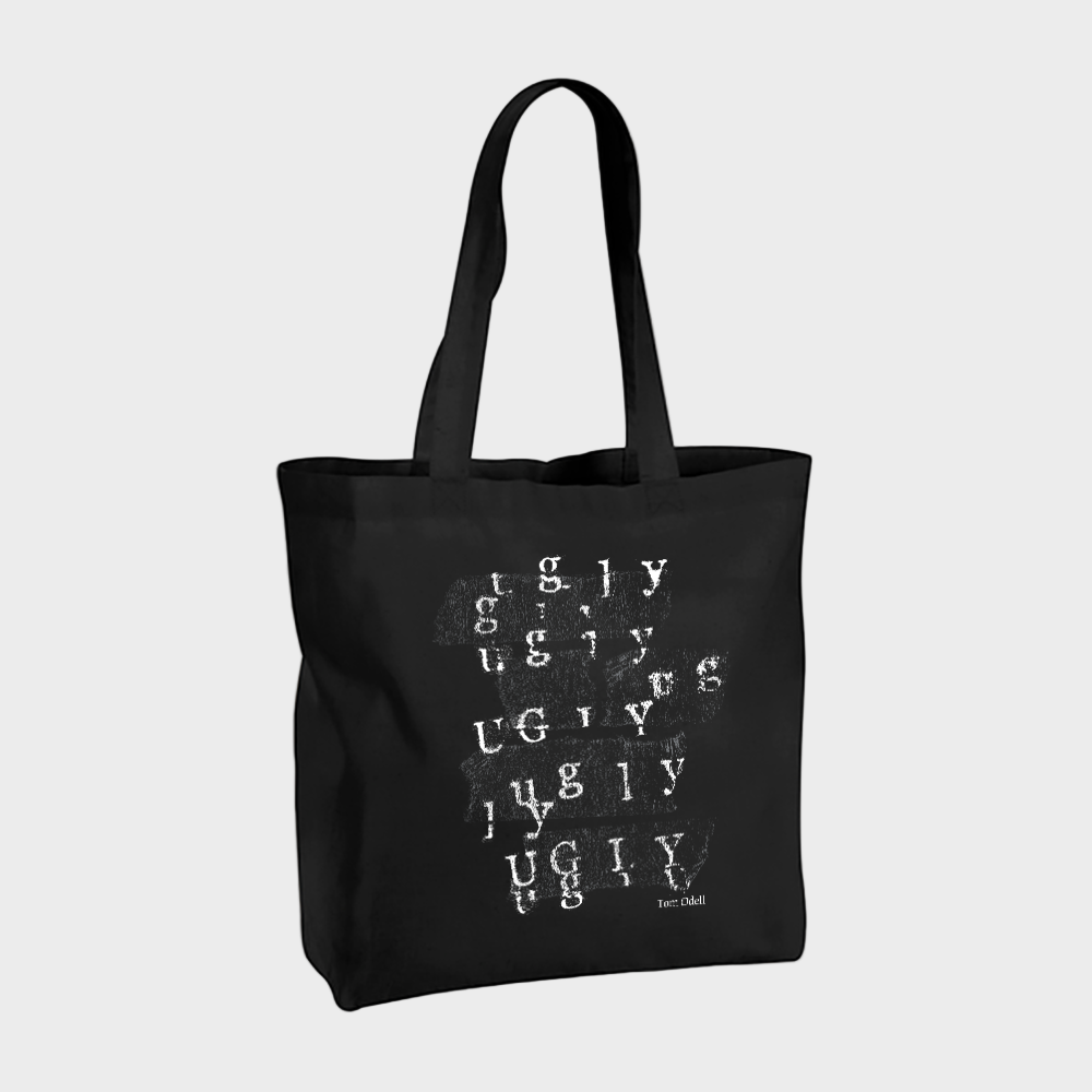 Black tote bag with white text